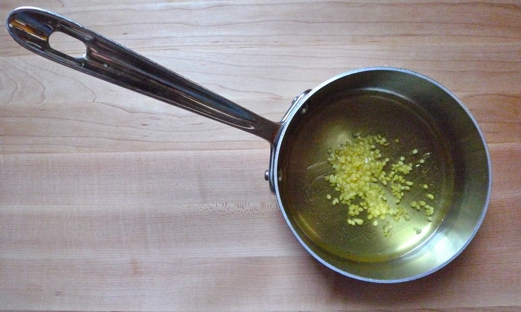 Step 1: Slowly melt oils with beeswax, swirling pan over heat source.