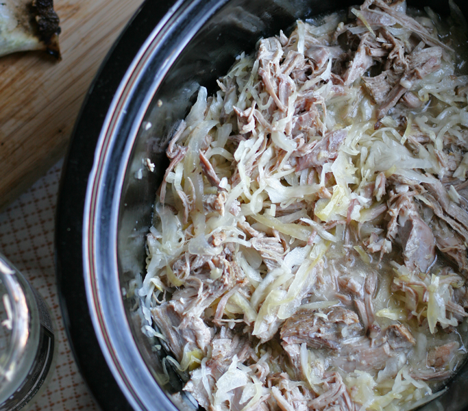 Break out the slow cooker! This garlic seared pork and kraut recipe is seriously one that will please the whole family. Plus, it's rich with probiotics!