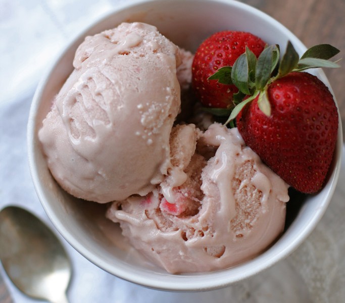 Enjoy this flavorful and creamy homemade dairy-free strawberry ice cream made with simple ingredients like maple syrup, coconut milk, vanilla, and pastured eggs.